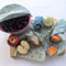 Reusable beeswax food wraps 3-pack made in Canada, showing large, medium, and small plastic-free wraps with lemon, floral, and botanical patterns.