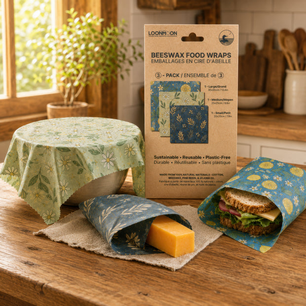 LOONMOON reusable beeswax food wraps made in Canada, shown covering a bowl, wrapping cheese, and holding a sandwich for plastic-free food storage.