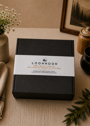 LOONMOON Core Beeswax Candle Box in minimalist black gift-ready packaging with branded sleeve on a rustic homestead-style background