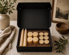 LOONMOON Core Beeswax Candle Box with 2 taper candles, 4 votives, and 6 tealights in a black gift box on a warm Canadian homestead table