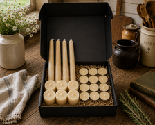 LOONMOON premium beeswax candle gift box featuring hand-poured taper candles, votive candles, and tealights in a black kraft presentation box with rustic farmhouse kitchen decor.