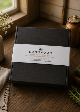 LOONMOON Premium Beeswax Candle Box in minimalist black kraft gift packaging displayed on a rustic farmhouse table with warm homestead decor and natural kitchen styling.