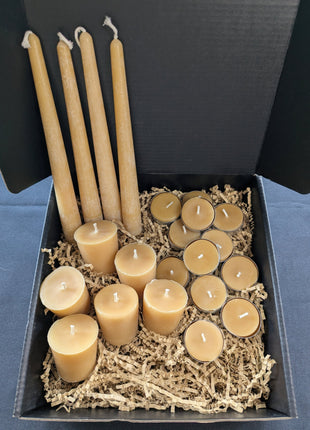 Open LOONMOON Premium Beeswax Candle Box with beeswax tapers, votives, and tealights packed in kraft crinkle paper.