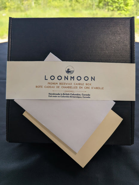 Close-up of LOONMOON Premium Beeswax Candle Box label with blank greeting card and envelope for a Canadian candle gift.