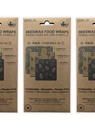Three premium 3-pack reusable beeswax food wrap packages made in Canada displayed on a clean white background to demonstrate the complete 9-wrap collection.  Plastic-free food storage wraps made from cotton, Canadian beeswax, pine resin, and jojoba oil, offering a sustainable alternative to plastic wrap for storing bread, cheese, fruit, vegetables, and leftovers.