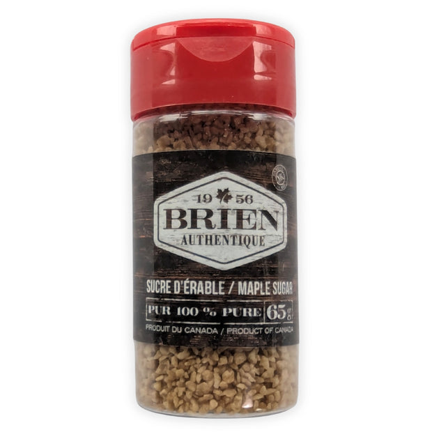 This image shows the front view of a Brien Authentique maple sugar shaker on a white background.  The clear plastic shaker has a red flip-top lid and contains coarse maple sugar crystals.  The front label reads Brien Authentique, maple sugar, pure 100%, 65 g, and Product of Canada.  This image clearly presents the product packaging and is ideal as a main product image for online store listings.