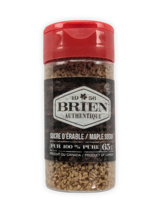 This image shows the front view of a Brien Authentique maple sugar shaker on a white background.  The clear plastic shaker has a red flip-top lid and contains coarse maple sugar crystals.  The front label reads Brien Authentique, maple sugar, pure 100%, 65 g, and Product of Canada.  This image clearly presents the product packaging and is ideal as a main product image for online store listings.