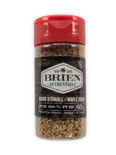 This image shows the front view of a Brien Authentique maple sugar shaker on a white background.  The clear plastic shaker has a red flip-top lid and contains coarse maple sugar crystals.  The front label reads Brien Authentique, maple sugar, pure 100%, 65 g, and Product of Canada.  This image clearly presents the product packaging and is ideal as a main product image for online store listings.
