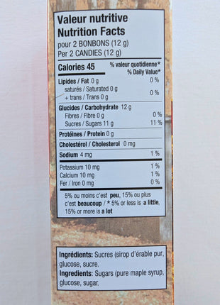 Bilingual Nutrition Facts and ingredients panel for the Canadian hard maple candies, showing a serving of two candies (12 g) and ingredients including pure maple syrup, glucose and sugar. The 100 g Canadian maple candy package provides clear nutritional and ingredient information for shoppers.