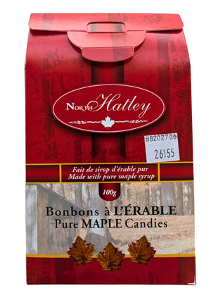 Back view of the 100 g Canadian hard maple candy package showing its red maple-themed design, pure maple syrup statement, product identification and best-before information. The bilingual Canadian packaging complements the maple-leaf-shaped hard candies sold inside.