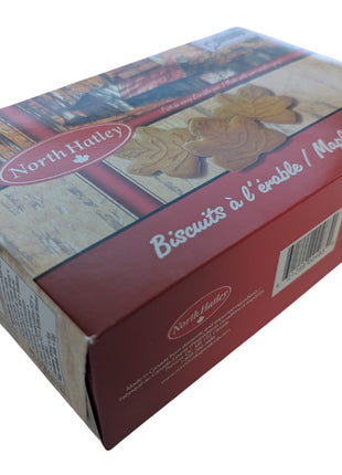 Angled view of a 400 g box of Canadian maple cream cookies showing the depth and rectangular shape of the package. The bilingual Canadian packaging contains maple-leaf sandwich cookies made with pure maple syrup and provides a useful view of the full retail box dimensions.