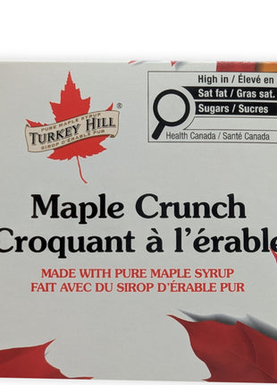 Front label of Canadian Maple Crunch dark chocolate bar made with pure maple syrup.  Close-up photograph of the Canadian Maple Crunch Dark Chocolate Bar packaging highlighting the product name, maple branding, and premium retail presentation.