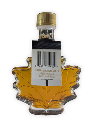 Back view of a 100 ml Canadian maple syrup leaf bottle showing the Canada Grade A Amber Rich Taste label and barcode.  Authentic Canadian maple syrup packaged in a traditional maple leaf bottle with product grading information for shoppers seeking genuine maple syrup from Canada.