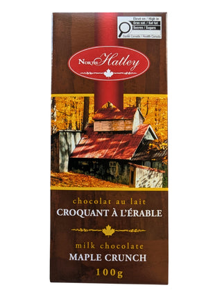 Front view of a 100 g Canadian Milk Chocolate Maple Crunch bar in bilingual maple-themed packaging. A Canadian chocolate treat combining creamy milk chocolate with maple sugar for a distinctly Canadian maple flavour.