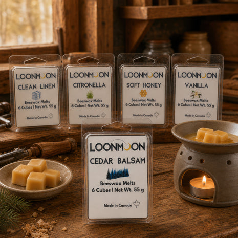 LOONMOON Cedar Balsam beeswax wax melts shown with Clean Linen, Citronella, Soft Honey, and Vanilla scents in a rustic workshop setting with wax cubes and a warmer.