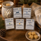 LOONMOON beeswax wax melts in five scents beside a glowing ceramic warmer and beeswax cubes on a rustic wooden table.