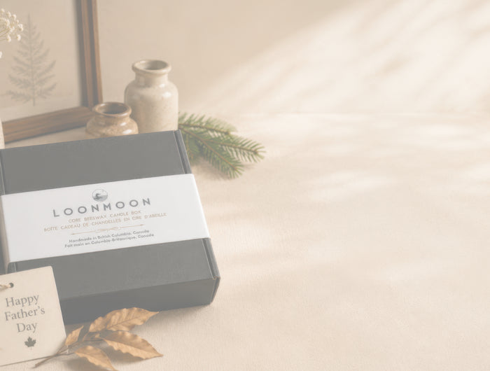Translucent image of Canadian Father’s Day beeswax candle gift box by LOONMOON, featuring black packaging, a Happy Father’s Day tag, and cozy rustic styling.