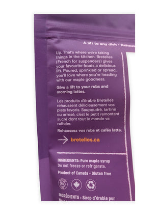 A close-up of the back of the fine maple sugar package showing the English and French product information, serving suggestions, pure maple syrup ingredient statement, storage directions, gluten-free wording and Product of Canada identification.