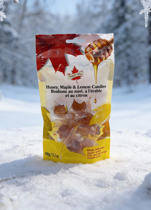 Honey, maple and lemon candies made with pure Canadian maple syrup displayed in a snowy winter forest setting