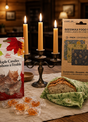 Beeswax wraps and maple candies in cozy cabin kitchen with lit taper candles – Canadian homestead bundle