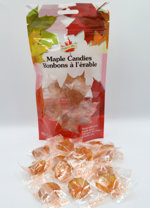 Maple candies in a bag with individually wrapped pieces displayed in front, made with pure maple syrup