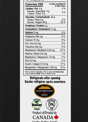 Nutrition facts label for maple syrup showing calories, carbohydrates, sugars, and minerals per 1/4 cup serving