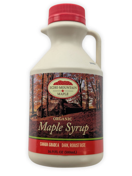 A front view of a 500 mL Echo Mountain organic maple syrup jug on a clean white background.  The cream-coloured jug has a red cap, built-in handle and pouring spout, with an autumn sugar-bush label identifying the syrup as Canada Grade A, dark with a robust taste.
