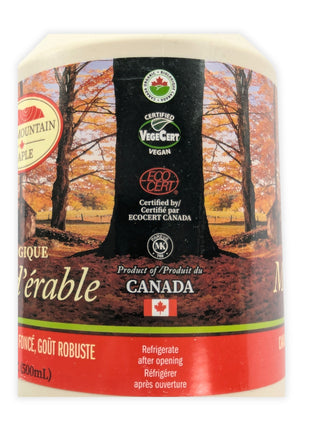 Close-up of the label on a 500 mL organic maple syrup jug showing the bilingual ingredient statement, organic maple syrup and sirop d’érable biologique, along with the Echo Mountain Maple producer information, Waterloo, Quebec address and product barcode.