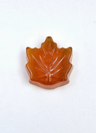 Single Canadian maple leaf candy made with pure maple syrup on a clean white background