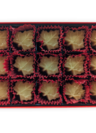 Open 15-piece soft maple sugar candy gift box made in Canada showing individually wrapped maple leaf candies arranged inside a premium red gift box.  Pure Canadian maple sugar candies ready for sharing, gifting and enjoying as an authentic Canadian sweet.